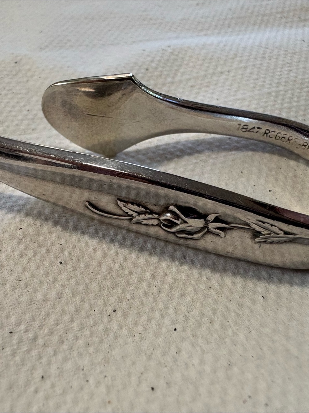 Silver 1847 Roger and bros set of six napkin clips.